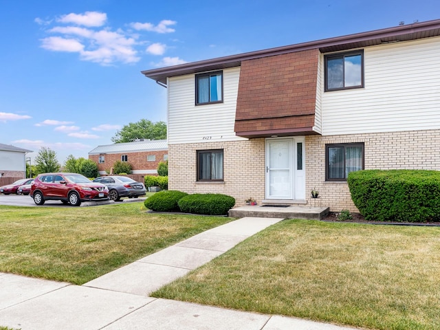 8429 162nd Pl Unit 3, Tinley Park, IL 60487 - multi unit property with brick siding, a front lawn, and uncovered parking