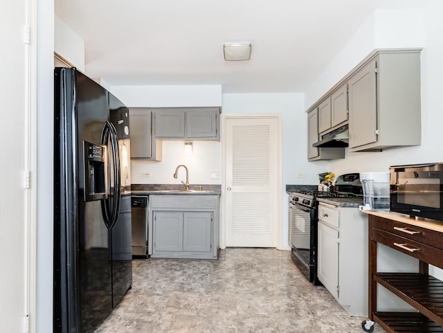 8429 162nd Pl Unit 3, Tinley Park, IL 60487 - kitchen with black appliances, under cabinet range hood, dark countertops, and gray cabinets