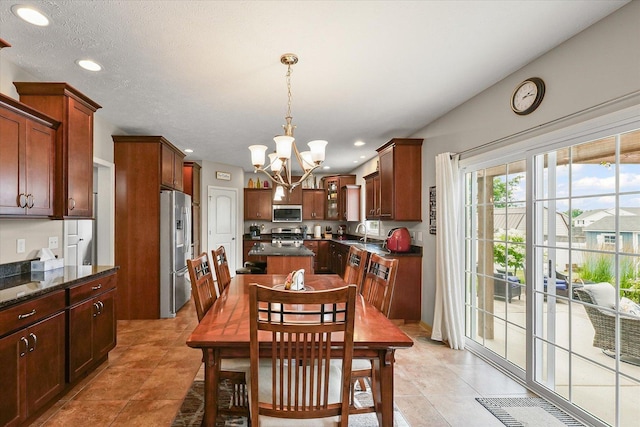 204 Campbell St, Tolono, IL 61880 - dining space featuring a chandelier, recessed lighting, and light tile patterned flooring