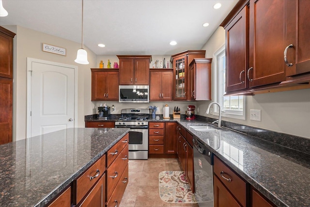 204 Campbell St, Tolono, IL 61880 - kitchen featuring stainless steel appliances, hanging light fixtures, glass insert cabinets, dark stone countertops, and recessed lighting