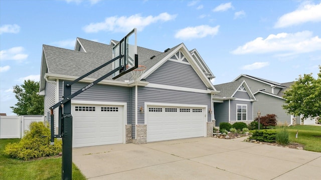 204 Campbell St, Tolono, IL 61880 - view of front of property with concrete driveway, roof with shingles, and an attached garage