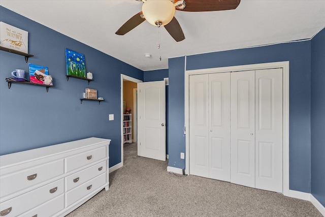 204 Campbell St, Tolono, IL 61880 - bedroom with light colored carpet, a closet, and ceiling fan