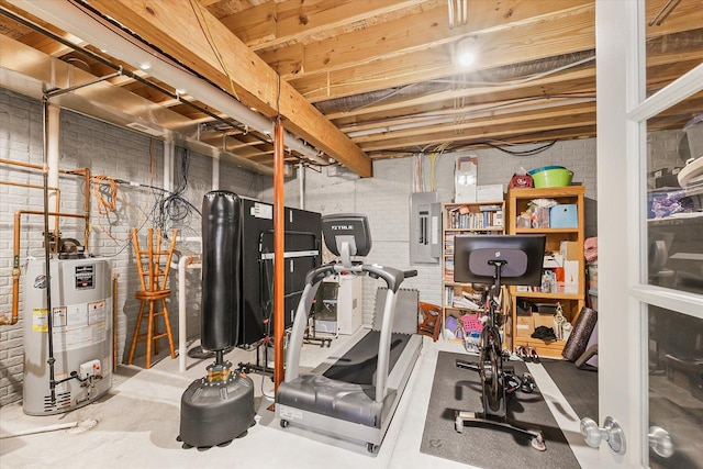 204 Campbell St, Tolono, IL 61880 - workout area with water heater, electric panel, and brick wall