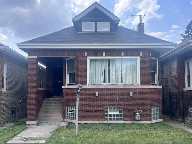 8616 S Justine St, Chicago, IL 60620 - bungalow-style house with brick siding and a chimney