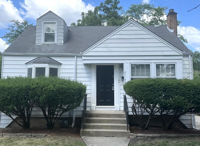 21142 Locust St, Matteson, IL 60443 - view of front of home featuring a chimney and a shingled roof