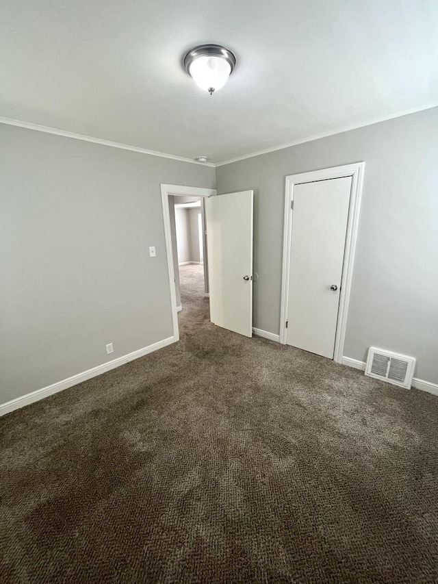 21142 Locust St, Matteson, IL 60443 - unfurnished bedroom featuring crown molding and dark colored carpet