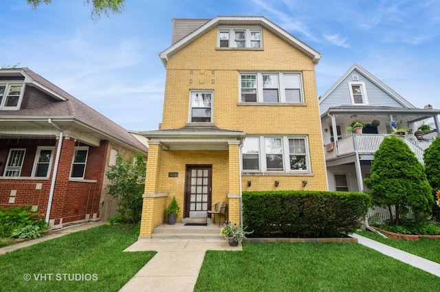 5128 W Carmen Ave, Chicago, IL 60630 - view of front of home featuring brick siding and a front lawn
