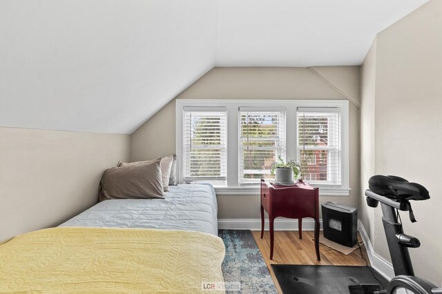 5128 W Carmen Ave, Chicago, IL 60630 - bedroom with wood finished floors and vaulted ceiling