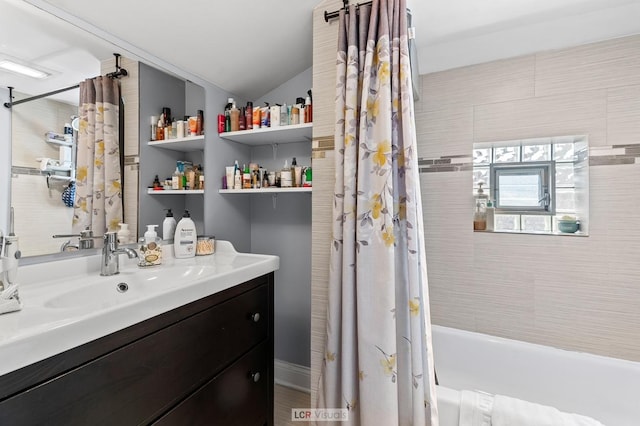 5128 W Carmen Ave, Chicago, IL 60630 - bathroom featuring shower / bath combo, vanity, and vaulted ceiling
