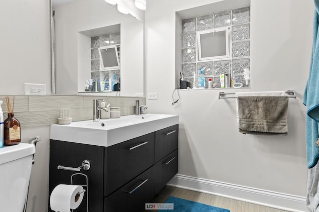5128 W Carmen Ave, Chicago, IL 60630 - bathroom with double vanity and wood finished floors