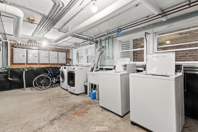 5128 W Carmen Ave, Chicago, IL 60630 - community laundry room featuring independent washer and dryer and electric panel