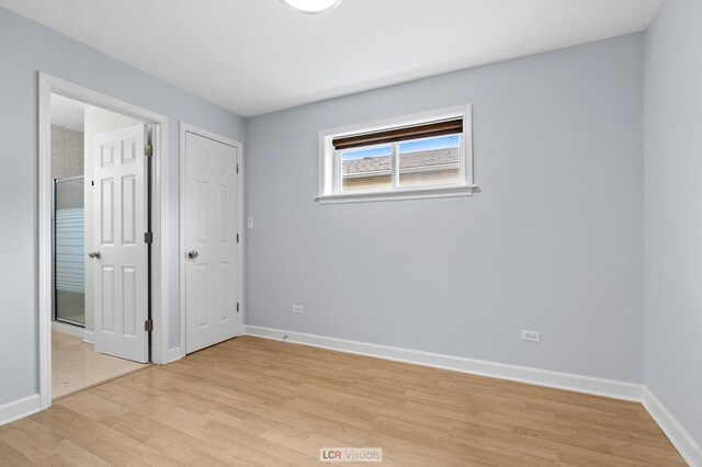 5128 W Carmen Ave, Chicago, IL 60630 - unfurnished bedroom featuring light wood-style flooring