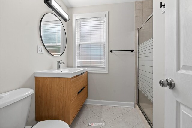 5128 W Carmen Ave, Chicago, IL 60630 - bathroom featuring vanity, a stall shower, and tile patterned flooring