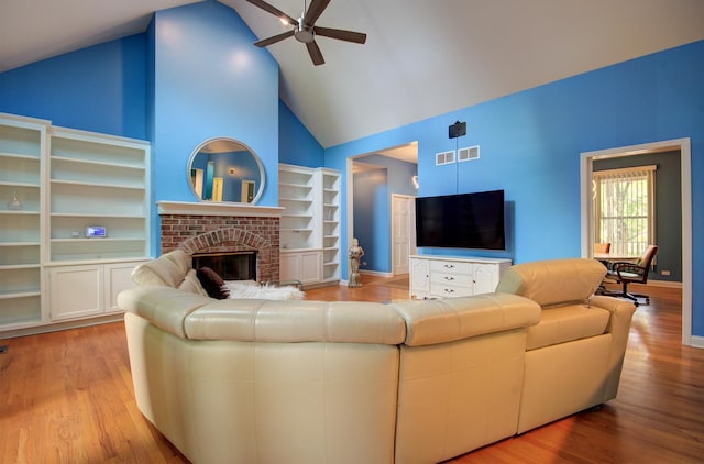 332 Stonemill Ln, Oswego, IL 60543 - living area with ceiling fan, high vaulted ceiling, wood finished floors, and a brick fireplace