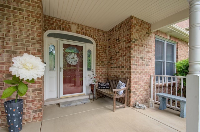 332 Stonemill Ln, Oswego, IL 60543 - view of exterior entry with a porch and brick siding