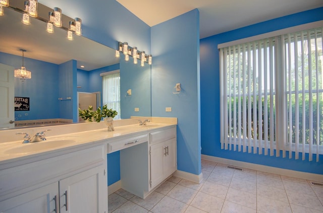 332 Stonemill Ln, Oswego, IL 60543 - bathroom featuring plenty of natural light, double vanity, and tile patterned flooring