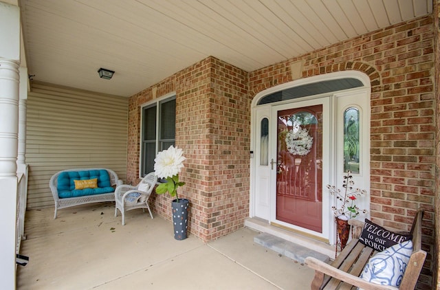 332 Stonemill Ln, Oswego, IL 60543 - property entrance featuring brick siding and a porch
