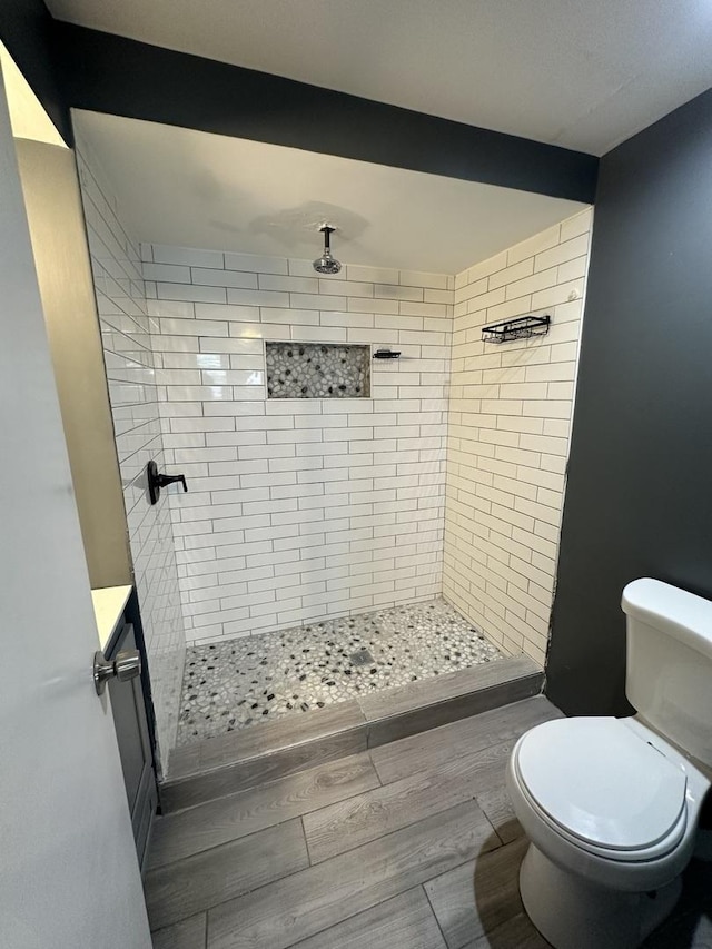 360 Chappel Ave, Calumet City, IL 60409 - bathroom featuring tiled shower and wood finished floors