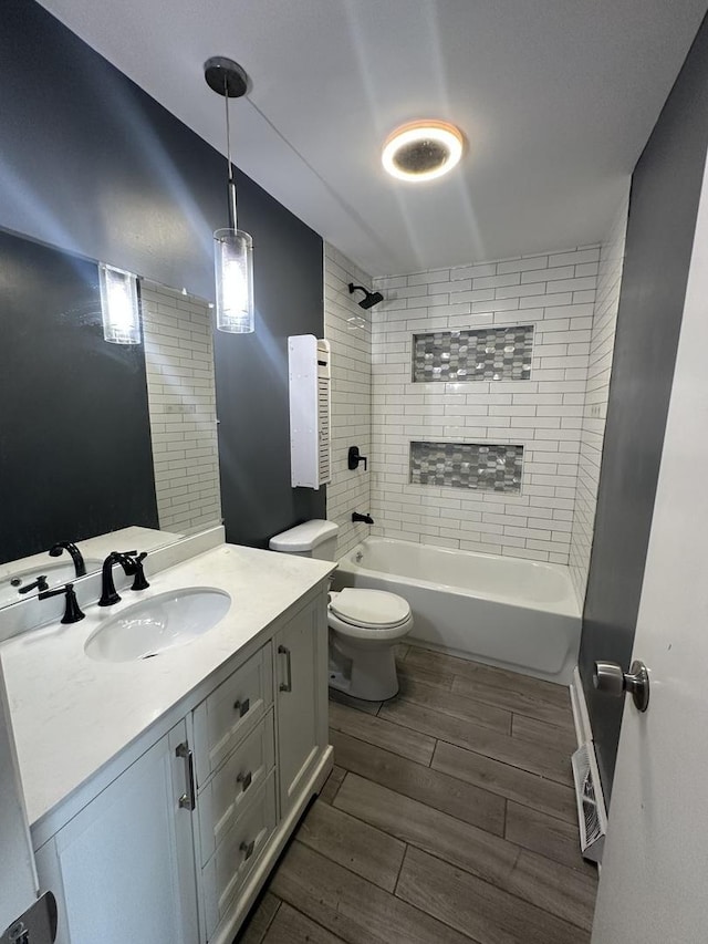 360 Chappel Ave, Calumet City, IL 60409 - bathroom featuring wood finished floors, vanity, and bathtub / shower combination