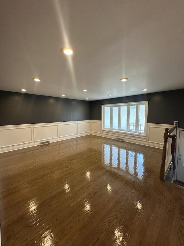 360 Chappel Ave, Calumet City, IL 60409 - spare room with a wainscoted wall, a decorative wall, dark wood-style flooring, and recessed lighting