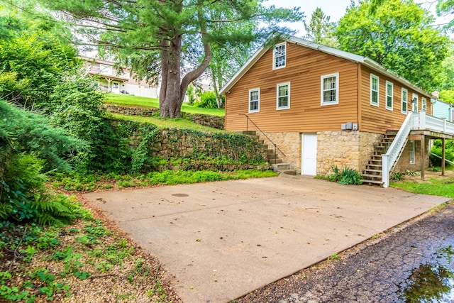 244 S Division St, Galena, IL 61036 - back of property with stairway and stone siding