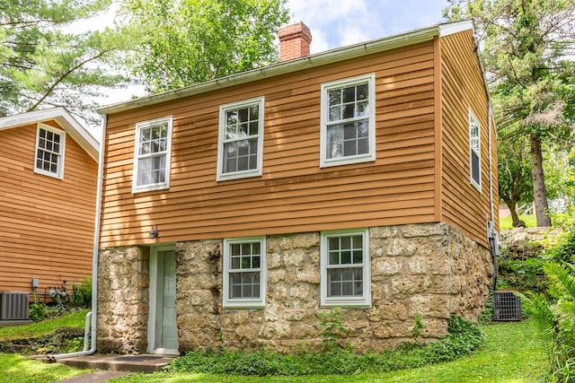 244 S Division St, Galena, IL 61036 - rear view of property featuring a chimney and stone siding