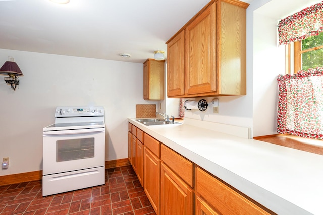 244 S Division St, Galena, IL 61036 - kitchen featuring electric stove, brick patterned floors, and light countertops