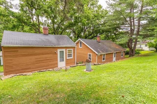 244 S Division St, Galena, IL 61036 - rear view of property featuring a chimney and a lawn