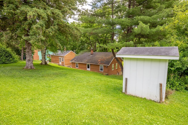 244 S Division St, Galena, IL 61036 - view of green lawn with a shed