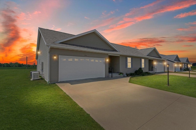 209A Evergreen St, Gifford, IL 61847 - ranch-style home with concrete driveway, an attached garage, a front yard, and a shingled roof