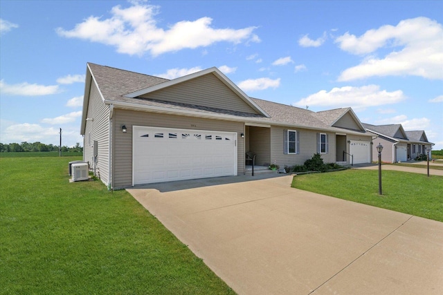 209A Evergreen St, Gifford, IL 61847 - ranch-style home featuring concrete driveway, a garage, a front lawn, and a shingled roof