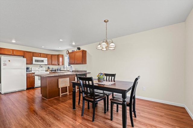 209A Evergreen St, Gifford, IL 61847 - dining room with wood finished floors, a chandelier, and recessed lighting