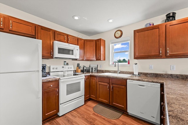 209A Evergreen St, Gifford, IL 61847 - kitchen featuring white appliances, light wood-style flooring, brown cabinets, and recessed lighting
