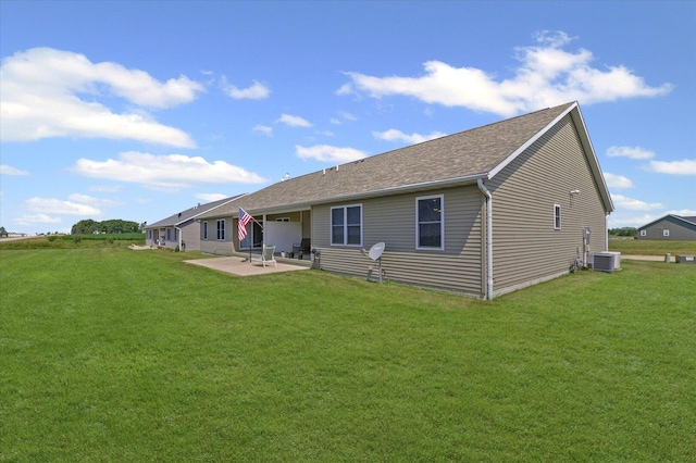 209A Evergreen St, Gifford, IL 61847 - rear view of house featuring a patio area, a yard, and a shingled roof