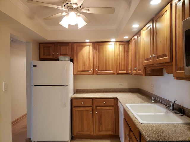 110 W Butterfield Rd Unit 405S, Elmhurst, IL 60126 - kitchen featuring white appliances, brown cabinetry, a raised ceiling, a ceiling fan, and recessed lighting