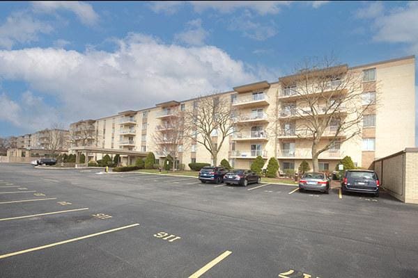 110 W Butterfield Rd Unit 405S, Elmhurst, IL 60126 - view of apartment building / complex featuring uncovered parking