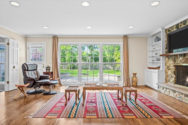 912 Morningside Dr, Lake Forest, IL 60045 - living room featuring crown molding, a fireplace, built in features, wood finished floors, and recessed lighting