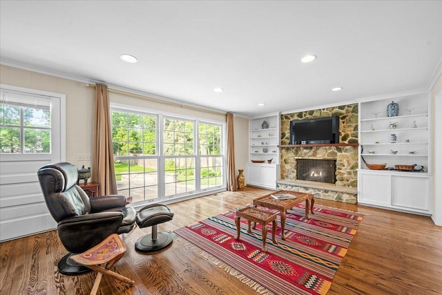 912 Morningside Dr, Lake Forest, IL 60045 - living area with ornamental molding, a fireplace, wood finished floors, built in shelves, and recessed lighting
