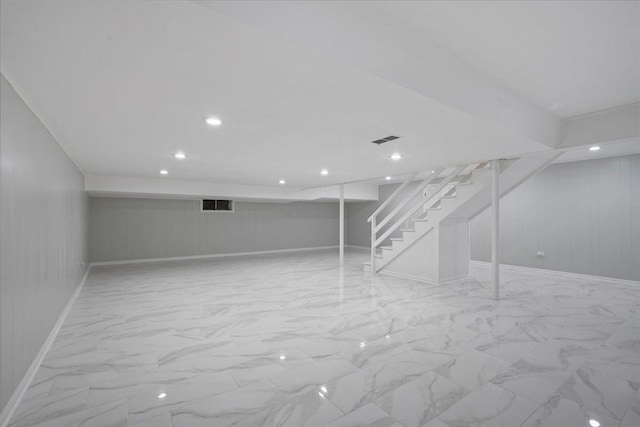 912 Morningside Dr, Lake Forest, IL 60045 - finished basement with stairway, light marble finish flooring, wood walls, and recessed lighting