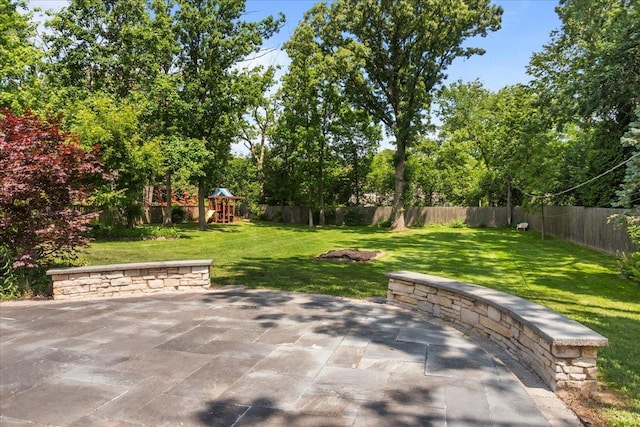 912 Morningside Dr, Lake Forest, IL 60045 - fenced backyard featuring a playground and a patio