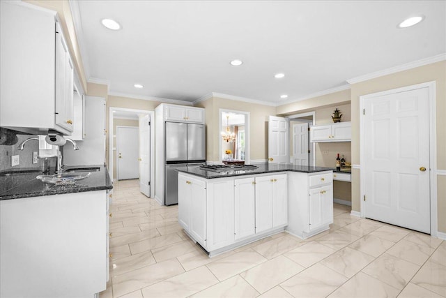 912 Morningside Dr, Lake Forest, IL 60045 - kitchen with stainless steel appliances, white cabinetry, recessed lighting, ornamental molding, and a kitchen island