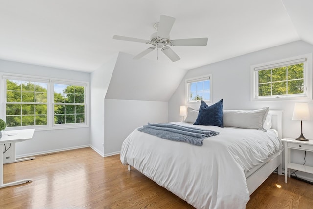 590 Oxford Ln, Lindenhurst, IL 60046 - bedroom featuring vaulted ceiling, wood finished floors, and ceiling fan
