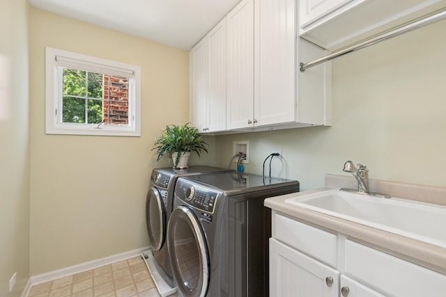 590 Oxford Ln, Lindenhurst, IL 60046 - laundry room featuring cabinet space, washer and dryer, and light floors