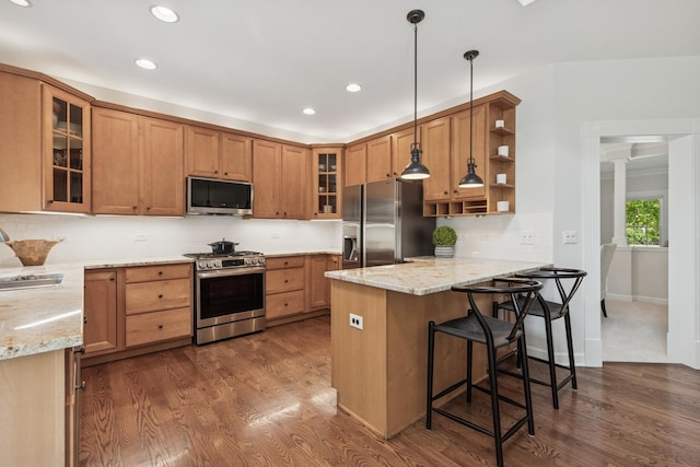 590 Oxford Ln, Lindenhurst, IL 60046 - kitchen with appliances with stainless steel finishes, a peninsula, open shelves, dark wood-type flooring, and light stone counters