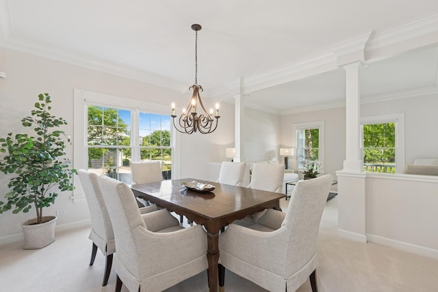 590 Oxford Ln, Lindenhurst, IL 60046 - dining area featuring light carpet, ornate columns, a chandelier, and ornamental molding