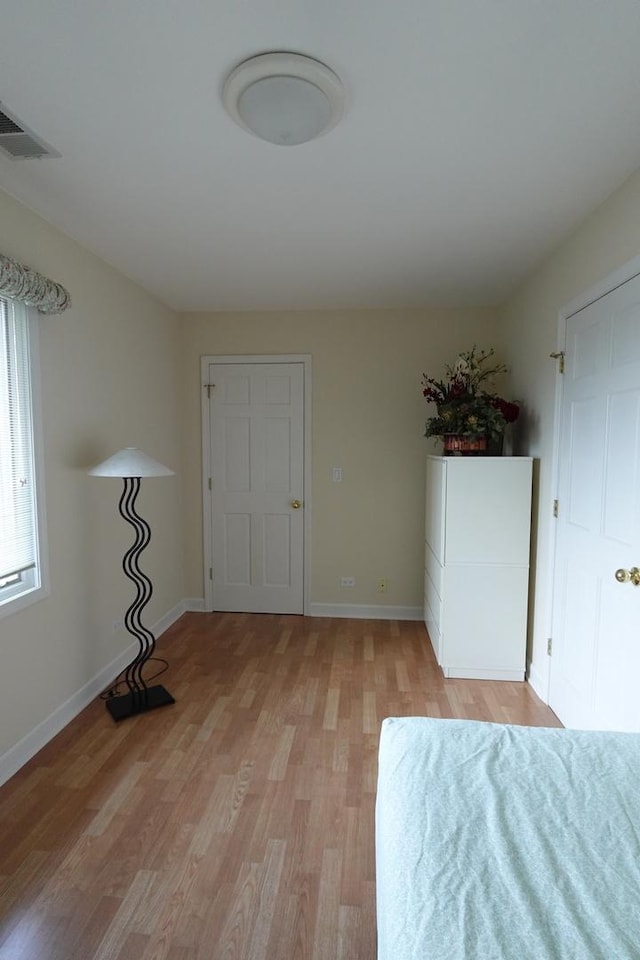 3533 N Natoma Ave, Chicago, IL 60634 - unfurnished bedroom featuring light wood finished floors and baseboards