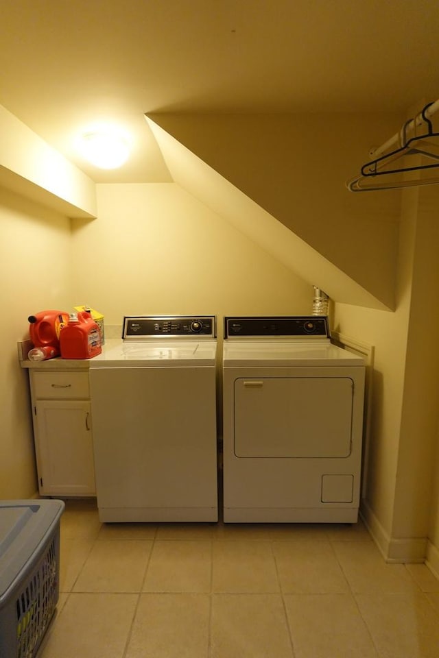 3533 N Natoma Ave, Chicago, IL 60634 - laundry area with washer and dryer, light tile patterned floors, and cabinet space