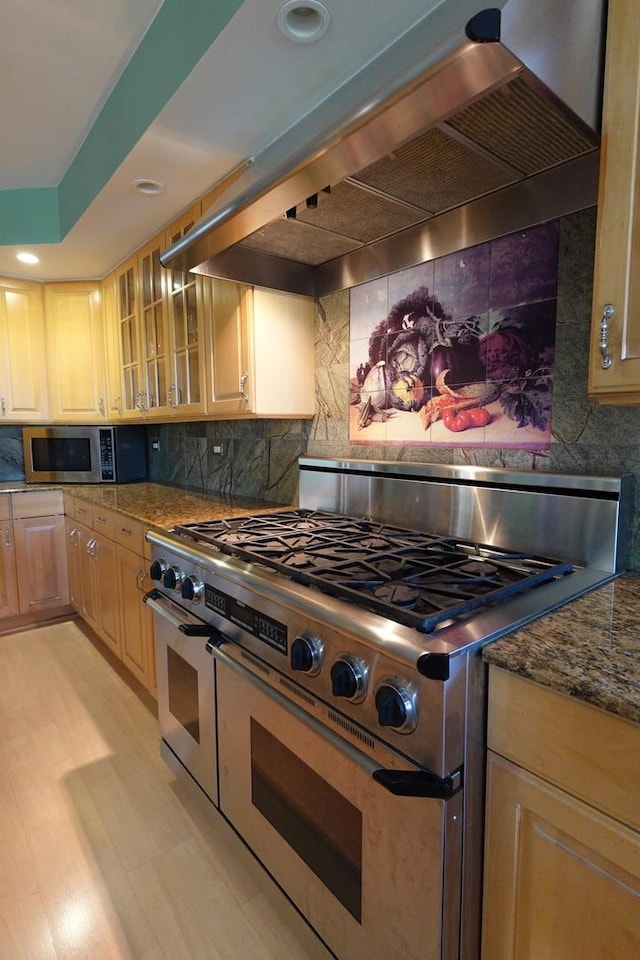 3533 N Natoma Ave, Chicago, IL 60634 - kitchen featuring stainless steel appliances, premium range hood, decorative backsplash, glass insert cabinets, and recessed lighting