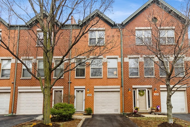 1487 N Clybourn Ave Unit B, Chicago, IL 60610 - multi unit property with driveway, brick siding, and a garage