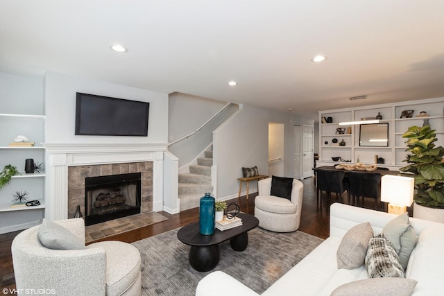 1487 N Clybourn Ave Unit B, Chicago, IL 60610 - living room with wood finished floors, stairway, a tile fireplace, and recessed lighting